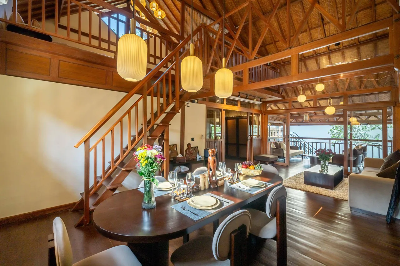Ubud EcoHouse — Dining area and stairs to the upper level